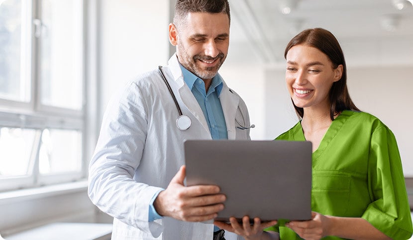 doctors looking at laptop