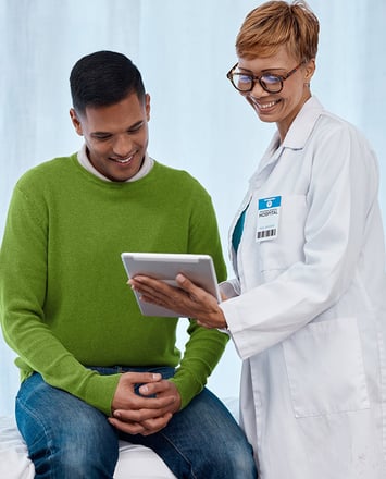 patient and doctor looking at tablet