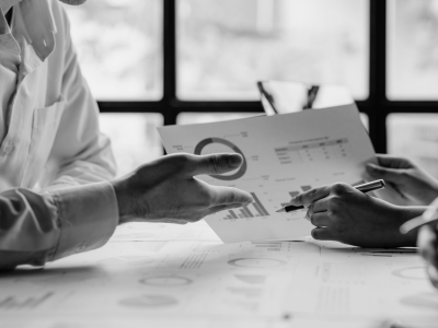 individuals having a business conversation reviewing data