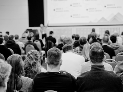 people attending a conference session 